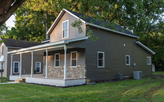 1120 8th St, Three Rivers, MI 49093 - view of property exterior with covered porch and a lawn