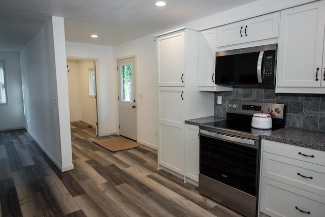 1120 8th St, Three Rivers, MI 49093 - kitchen featuring stainless steel range with electric stovetop, tasteful backsplash, recessed lighting, white cabinetry, and dark wood-type flooring