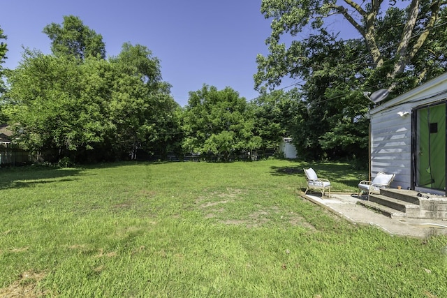 284 Devonshire St, Ypsilanti, MI 48198 - view of green lawn with a storage unit