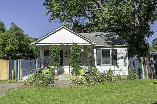 284 Devonshire St, Ypsilanti, MI 48198 - bungalow-style house featuring covered porch, a chimney, and roof with shingles