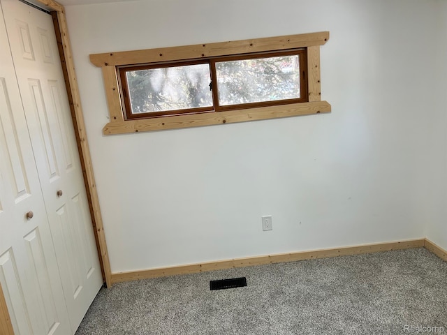 221 Bluegill Lake Dr, Frost, MI 48625 - carpeted empty room with baseboards