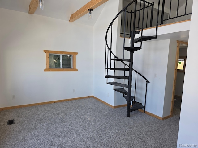 221 Bluegill Lake Dr, Frost, MI 48625 - stairs with carpet flooring, beamed ceiling, and a high ceiling