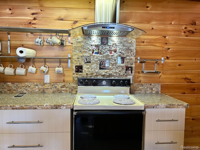 221 Bluegill Lake Dr, Frost, MI 48625 - kitchen with electric stove, island exhaust hood, white cabinets, and backsplash