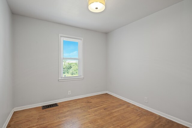3061 Homewood St SW, Grandville, MI 49418 - spare room featuring baseboards and wood finished floors