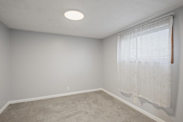 3061 Homewood St SW, Grandville, MI 49418 - spare room featuring carpet and baseboards