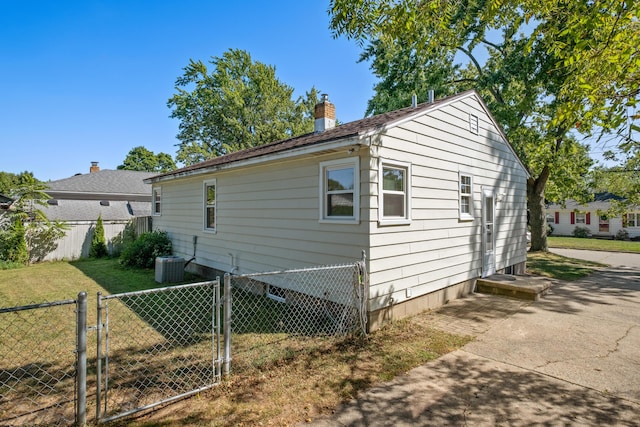 3061 Homewood St SW, Grandville, MI 49418 - view of property exterior with a gate and a chimney