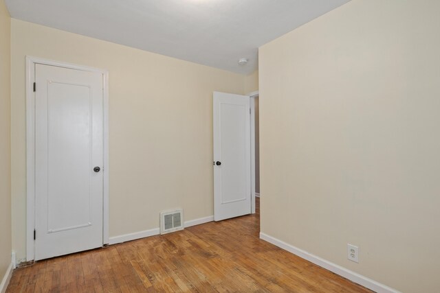 3061 Homewood St SW, Grandville, MI 49418 - unfurnished room with wood finished floors and baseboards