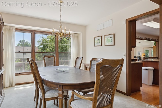 48721 W Normandy Ct, Plymouth, MI 48170 - dining area with a chandelier, healthy amount of natural light, and light colored carpet