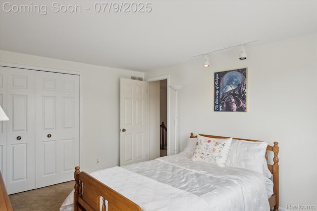 48721 W Normandy Ct, Plymouth, MI 48170 - carpeted bedroom featuring rail lighting and a closet
