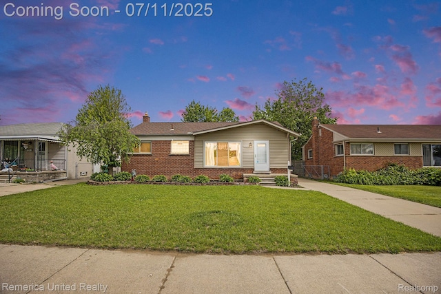 28640 Florence St, Northville, MI 48135 - ranch-style house featuring brick siding, a front yard, and a chimney