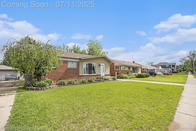 28640 Florence St, Northville, MI 48135 - ranch-style home with brick siding and a front lawn