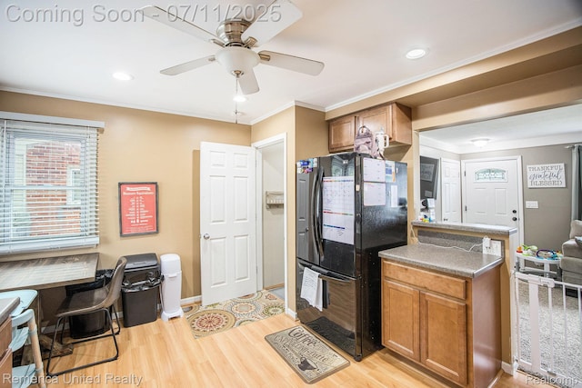 28640 Florence St, Northville, MI 48135 - kitchen featuring freestanding refrigerator, ceiling fan, light wood-style flooring, an office area, and brown cabinets