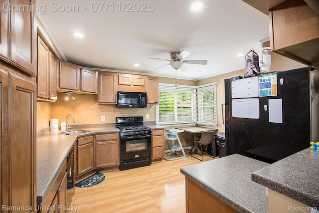 28640 Florence St, Northville, MI 48135 - kitchen featuring black appliances, light wood-style floors, ceiling fan, recessed lighting, and dark countertops