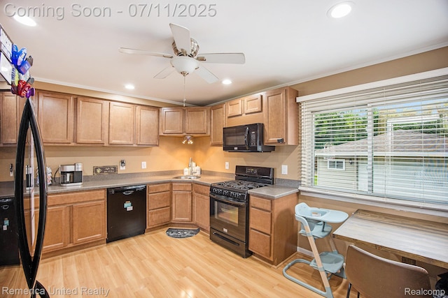 28640 Florence St, Northville, MI 48135 - kitchen featuring black appliances, ornamental molding, light wood-type flooring, a ceiling fan, and light countertops