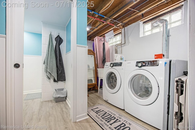 28640 Florence St, Northville, MI 48135 - laundry room with washing machine and dryer and wood finished floors