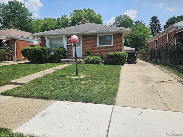 19370 Dequindre St, Detroit, MI 48234 - bungalow-style house featuring brick siding, a chimney, and a shingled roof