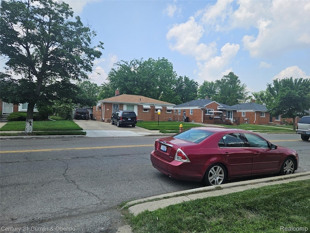 19370 Dequindre St, Detroit, MI 48234 - view of asphalt road with curbs and sidewalks