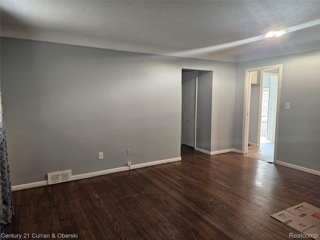 19370 Dequindre St, Detroit, MI 48234 - empty room with wood finished floors and a textured ceiling