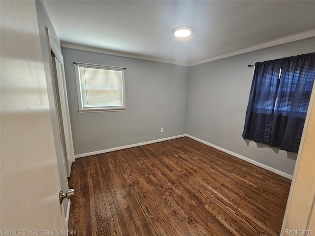 19370 Dequindre St, Detroit, MI 48234 - empty room featuring dark wood-type flooring and baseboards