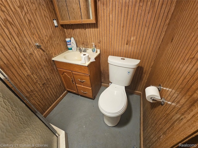 19370 Dequindre St, Detroit, MI 48234 - bathroom with vanity, wood walls, and finished concrete floors
