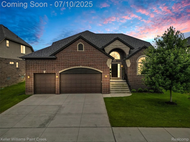 62777 Franklin Park Dr, Washington, MI 48094 - french country home featuring brick siding, an attached garage, and a lawn