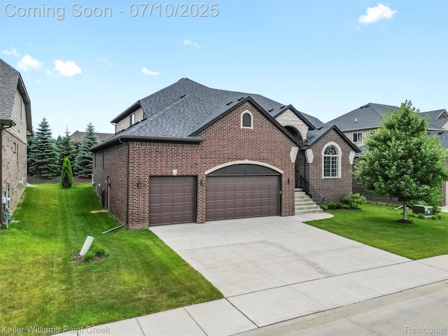 62777 Franklin Park Dr, Washington, MI 48094 - french country home featuring brick siding, driveway, a shingled roof, a front lawn, and an attached garage