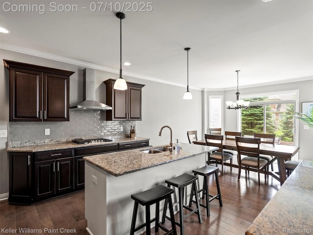62777 Franklin Park Dr, Washington, MI 48094 - kitchen featuring wall chimney exhaust hood, stainless steel gas stovetop, dark wood-type flooring, light stone countertops, and decorative backsplash