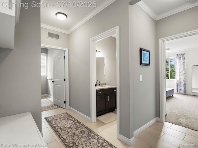 62777 Franklin Park Dr, Washington, MI 48094 - hallway featuring ornamental molding, light carpet, and light tile patterned floors