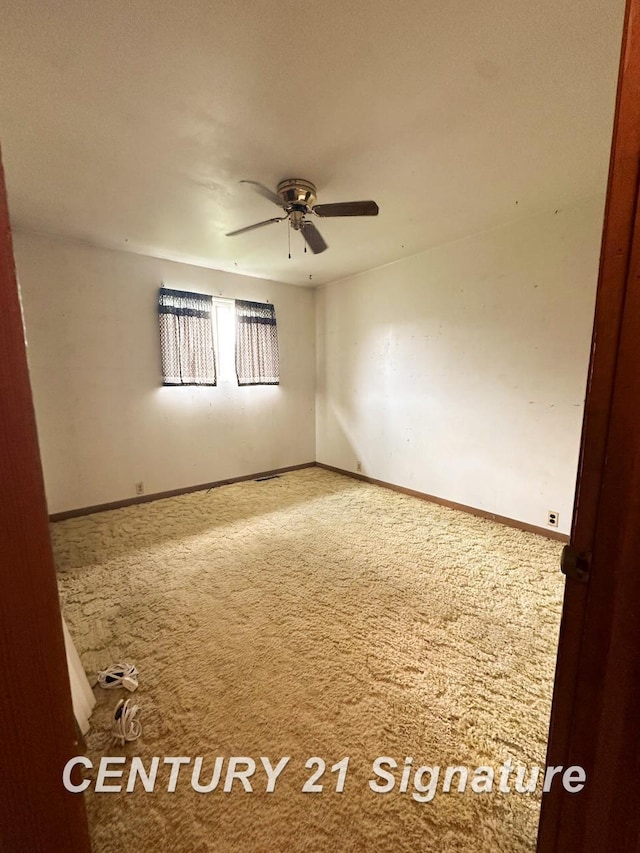 2410 Jossman Rd, Holly, MI 48442 - carpeted spare room with a ceiling fan and baseboards