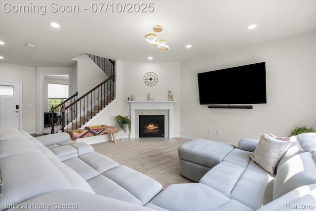 28049 Hummingdale Cir, Novi, MI 48377 - living area with carpet floors, recessed lighting, a fireplace, and stairway