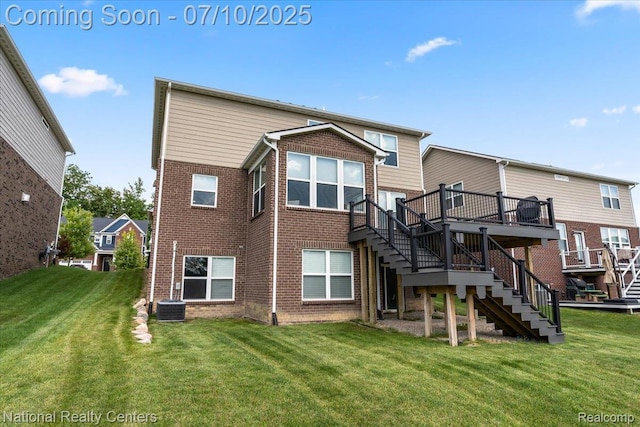28049 Hummingdale Cir, Novi, MI 48377 - back of property featuring stairway, brick siding, a deck, and a yard