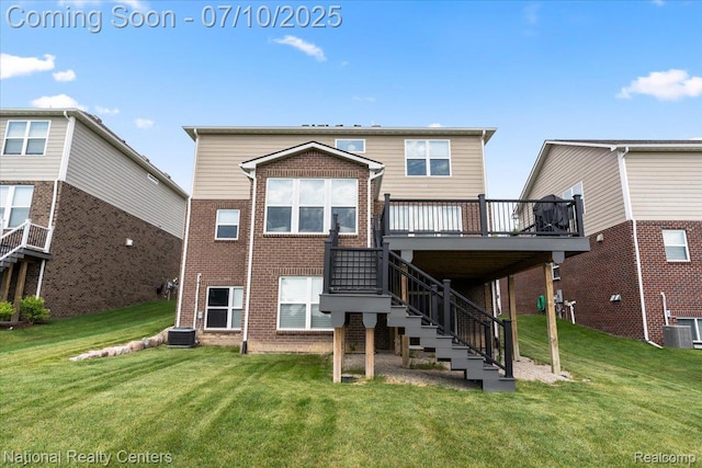 28049 Hummingdale Cir, Novi, MI 48377 - back of property with a wooden deck, brick siding, a yard, and stairway