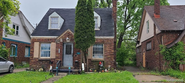 5035 Balfour Rd, Detroit, MI 48224 - view of front of property featuring brick siding, a front yard, and a shingled roof