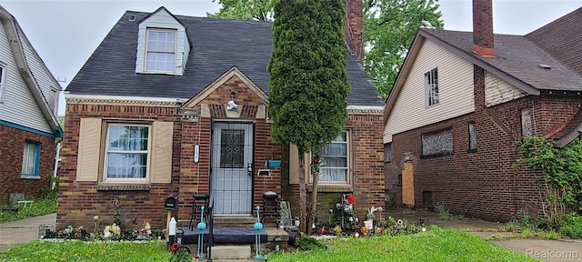 5035 Balfour Rd, Detroit, MI 48224 - view of front of house featuring brick siding and roof with shingles