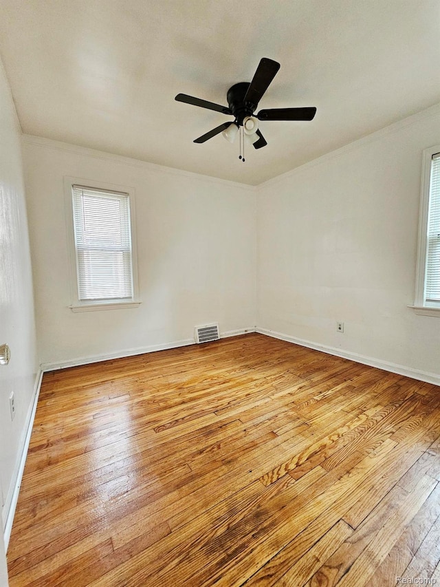20226 Mccormick, Detroit, MI 48224 - empty room featuring wood-type flooring, crown molding, and ceiling fan