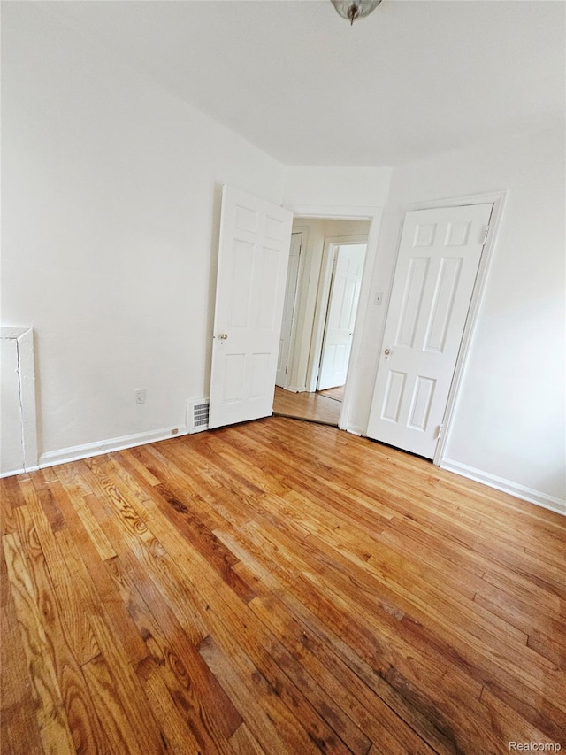 20226 Mccormick, Detroit, MI 48224 - unfurnished bedroom with light wood-style floors and baseboards