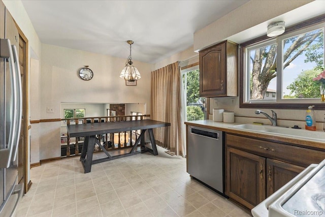 42109 Hartford Dr, Canton, MI 48187 - kitchen with appliances with stainless steel finishes, plenty of natural light, and a chandelier