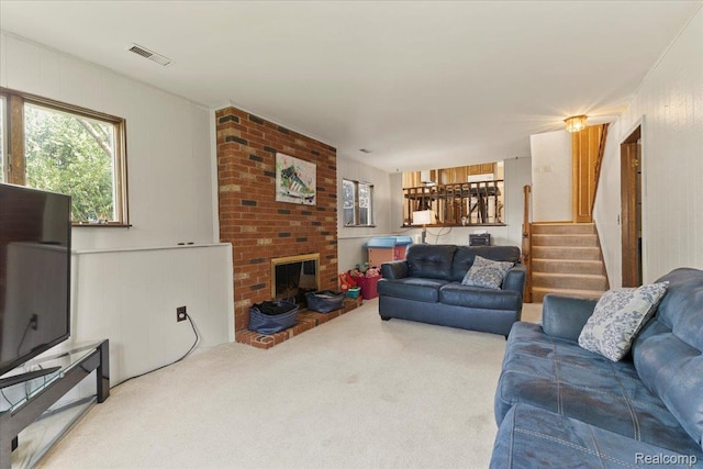42109 Hartford Dr, Canton, MI 48187 - carpeted living room with stairway and a fireplace