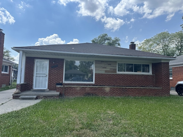 20523 Burt Rd, Detroit, MI 48219 - bungalow with brick siding, a front lawn, and a chimney