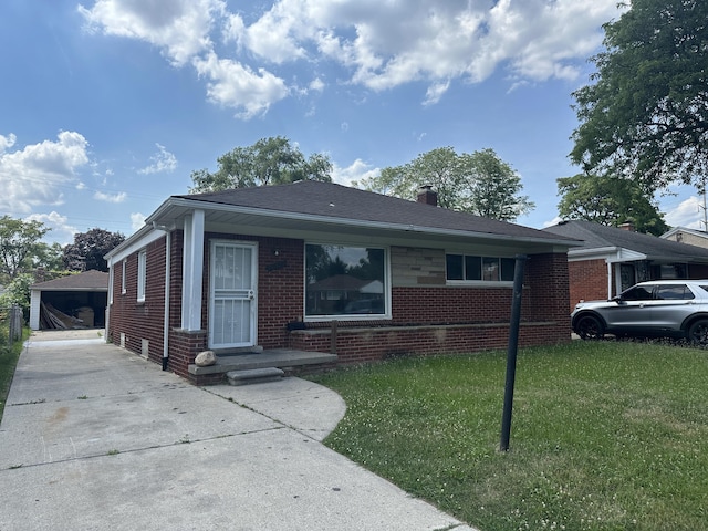 20523 Burt Rd, Detroit, MI 48219 - view of front of home with brick siding, a front lawn, and a chimney