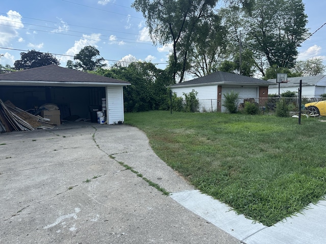 20523 Burt Rd, Detroit, MI 48219 - view of yard with a garage and an outbuilding