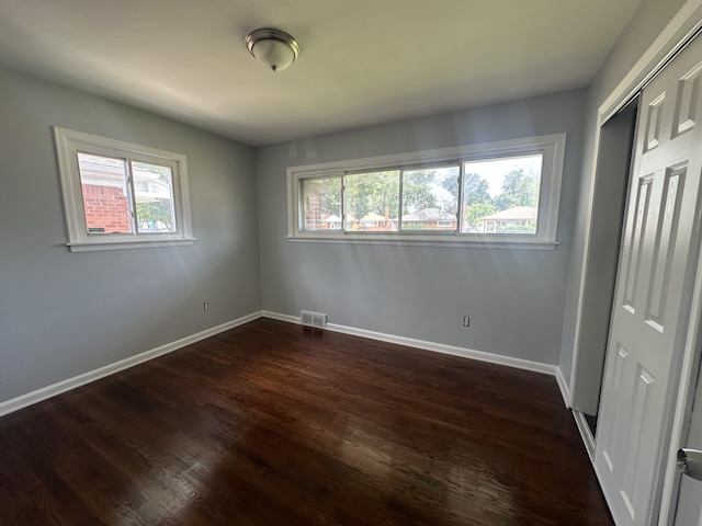20523 Burt Rd, Detroit, MI 48219 - unfurnished bedroom featuring dark wood finished floors and a closet
