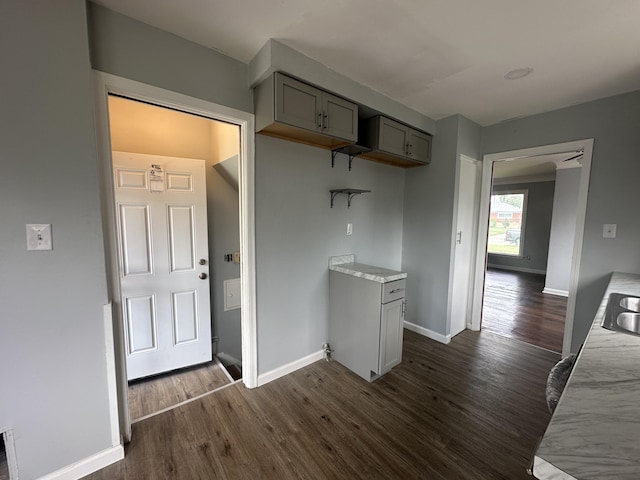 20523 Burt Rd, Detroit, MI 48219 - kitchen with gray cabinetry, dark wood-style floors, and light stone countertops