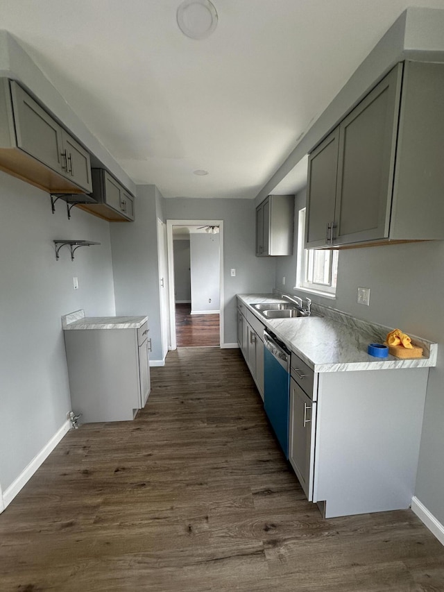 20523 Burt Rd, Detroit, MI 48219 - kitchen featuring dishwashing machine, gray cabinets, light countertops, and dark wood-type flooring