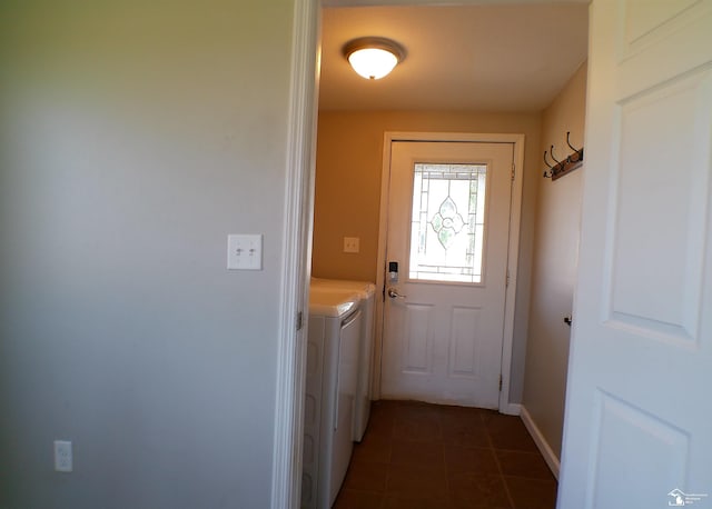 3380 Stewart Rd, Monroe, MI 48162 - doorway featuring washing machine and clothes dryer and dark tile patterned flooring