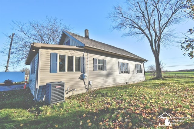 3380 Stewart Rd, Monroe, MI 48162 - back of property featuring a yard and a chimney