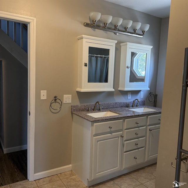 3380 Stewart Rd, Monroe, MI 48162 - full bath featuring double vanity and tile patterned flooring