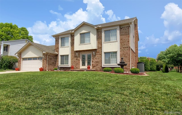 38188 Mallory Dr, Livonia, MI 48154 - view of front facade featuring french doors, a garage, a front lawn, and brick siding