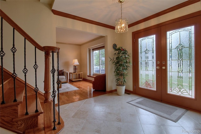 38188 Mallory Dr, Livonia, MI 48154 - foyer featuring stairs, a chandelier, light tile patterned floors, french doors, and crown molding