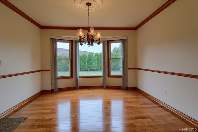 38188 Mallory Dr, Livonia, MI 48154 - unfurnished room featuring plenty of natural light, a chandelier, light wood finished floors, and ornamental molding